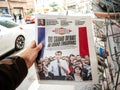 Grand Debat Emmanuel Macron on Liberation Newspaper POV man shopping press