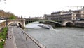 Boat passing under The Pont Notre-Dame on The River Seine. Paris France. March 29, 2023.