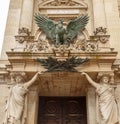 Paris, France, March 30, 2017: An eagle sculpture by Pierre Loiuis Rouillard, look out from the facade of Garnier. This