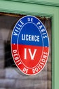 French \'licence IV\' sign allowing an establishment to sell alcoholic beverages, Paris, France