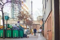 Paris, France - March 16, 2023: Messy streets with overfull garbage bins during binmen strike in Paris, France