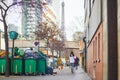 Paris, France - March 16, 2023: Messy streets with overfull garbage bins during binmen strike in Paris, France