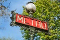 Paris, France, March 30, 2017: Metro subway underground sign Paris France. Paris Metropolitain entrance station. A pole Royalty Free Stock Photo