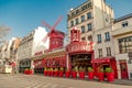 Paris, France, March 31 2017: Moulin Rouge is a famous cabaret built in 1889, locating in the Paris red-light district Royalty Free Stock Photo