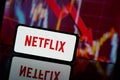 Netflix company shares go down at stock market. Netflix company financial crisis and failure. Economy collapse