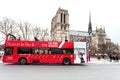 Red sightseeing bus and Paris Notre Dame Royalty Free Stock Photo