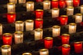 Paris, France, March 27 2017: Rows of firing lit votive candles inside Notre Dame de Paris, France Royalty Free Stock Photo