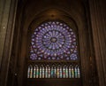 Paris, France, March 27, 2017: Stained glass window at Notre Dame cathedral. Notre Dame church is one of the top tourist Royalty Free Stock Photo