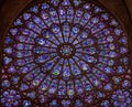 Paris, France, March 27, 2017: Stained glass window at Notre Dame cathedral. Notre Dame church is one of the top tourist Royalty Free Stock Photo