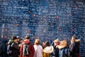 Tourists at the I Love You Wall located at the famous Parisian Montmartre neighborhood in winter Royalty Free Stock Photo