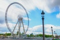 Paris, France - May 2, 2017: The Big Wheel at Place de la Concorde view from Tuileries Garden with the crowd and cloudy sky in Royalty Free Stock Photo