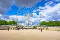 Paris, France - May 2, 2017: The Big Wheel at Place de la Concorde view from Tuileries Garden with the crowd and cloudy sky in Royalty Free Stock Photo