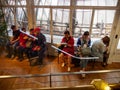 Tourists wait on benches at Galeries Lafayette, Paris, France Royalty Free Stock Photo