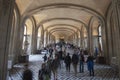 Interior view of Paris Louvre Museum gallery when tourists visit art galleries Royalty Free Stock Photo