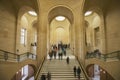 Interior view of Paris Louvre Museum gallery when tourists visit art galleries Royalty Free Stock Photo