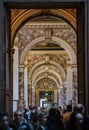 Interior view of Paris Louvre Museum gallery when tourists visit art galleries Royalty Free Stock Photo