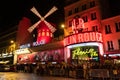 Paris, France, 15 May 2019 - Moulin Rouge is a famous wildmill and cabaret built in 1889, locating in the Paris red - Royalty Free Stock Photo