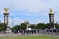 Paris, France - May 1, 2018: The Pont Alexandre III bridge across the Seine River and Petit Palais on the riverside, in front of Royalty Free Stock Photo