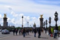 Paris, France - May 1, 2018: The Pont Alexandre III bridge across the Seine River and Petit Palais on the riverside, in front of Royalty Free Stock Photo