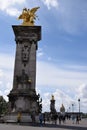 Paris, France - May 1, 2018: The Pont Alexandre III bridge across the Seine River and Petit Palais on the riverside, in front of Royalty Free Stock Photo