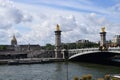 Paris, France - May 1, 2018: The Pont Alexandre III bridge across the Seine River and Petit Palais on the riverside, in front of Royalty Free Stock Photo