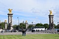 Paris, France - May 1, 2018: The Pont Alexandre III bridge across the Seine River and Petit Palais on the riverside, in front of Royalty Free Stock Photo