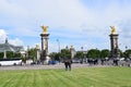 Paris, France - May 1, 2018: The Pont Alexandre III bridge across the Seine River and Petit Palais on the riverside, in front of Royalty Free Stock Photo