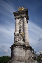 Paris, France - May 1, 2018: The Pont Alexandre III bridge across the Seine River and Petit Palais on the riverside, in front of Royalty Free Stock Photo