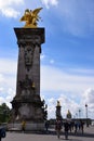 Paris, France - May 1, 2018: The Pont Alexandre III bridge across the Seine River and Petit Palais on the riverside, in front of Royalty Free Stock Photo