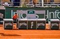 Roland Garros tennis players` bench with Perrier logo at Le Stade Roland Garros in Paris