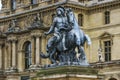 Paris, France - May 1, 2017: Statue of King Louis XIV in the courtyard of the Louvre Museum (Musee Du Louvre) on May 1, 2017, in