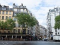 Paris, France - May 9th 2023: Lively square in Saint-Germain-de-Pres with historic buildings and restaurants