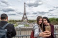 PARIS, FRANCE - MAY 2, 2016: Tourist taking pictures at Tour Eiffel town symbol Royalty Free Stock Photo