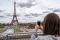 PARIS, FRANCE - MAY 2, 2016: Tourist taking pictures at Tour Eiffel town symbol Royalty Free Stock Photo