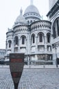 Paris, France, 11.22.2018 Montmartre, Sacre Coeur Basilica. The reverse side of the building facade with an information plate.