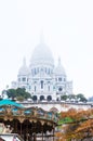 Paris, France, 11.22.2018 Montmartre, View of the Sacre Coeur Basilica and the top of the carousel on a fall day Royalty Free Stock Photo