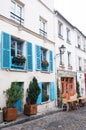 Paris, France, 11.22.2018 Montmartre, View of the traditional old French house facade in Paris with two windows. Royalty Free Stock Photo