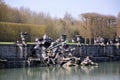 Paris, France 03.26.2017: Neptune Fountain in gardens of famous Versailles palace. Royalty Free Stock Photo