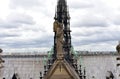 Notre Dame Spire, La Fleche, and lead clad wooden roofs before the fire. Angel statue, Apostles and Evangelists. Paris, France.