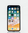Apple iPhone X on white background home screen apps Royalty Free Stock Photo