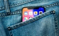 New Apple iPhone X 10 in pocket of denim jeans trousers Royalty Free Stock Photo