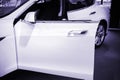 White Tesla Model S electric open driver door