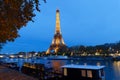 The night view of the Eiffel Tower, famous monument glowing at dusk located at bord of Seine river. Paris.France.