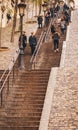 Paris, France - November 29, 2013: People on a narrow stairs in Montmartre. Tourists take the stairs leading to the Basilica Sacre