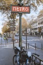 PARIS, FRANCE - November 21, 2023: Red metro sign in Paris