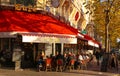 The traditional Parisian cafe Le Castel located near Eiffel tower in Paris, France. Royalty Free Stock Photo