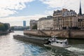 Paris, France Oct 3 2015: Barge traveling on the Seine River in Paris, France