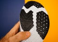 Man hand holding new Nike Running Shoe Odyssey React Shield