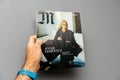 Man holding M Magazine le monde with Anne Leibovitz