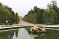 Scenic view of Flora Fountain in Gardens of Versailles at Paris, France under a cloudy sky